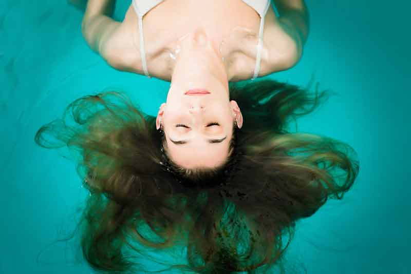 Woman floating in salt water