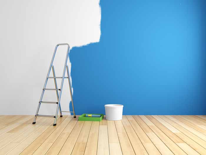 Wall being painted blue