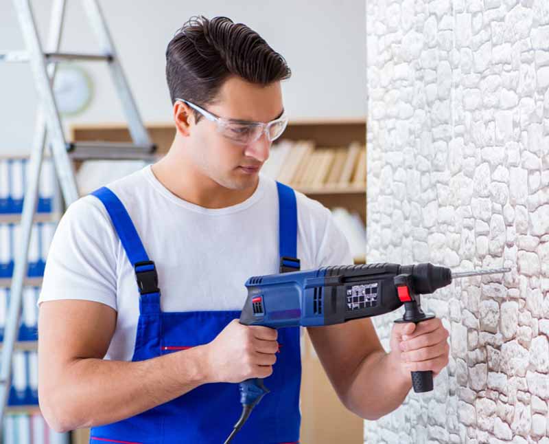 Man working with hammer drill